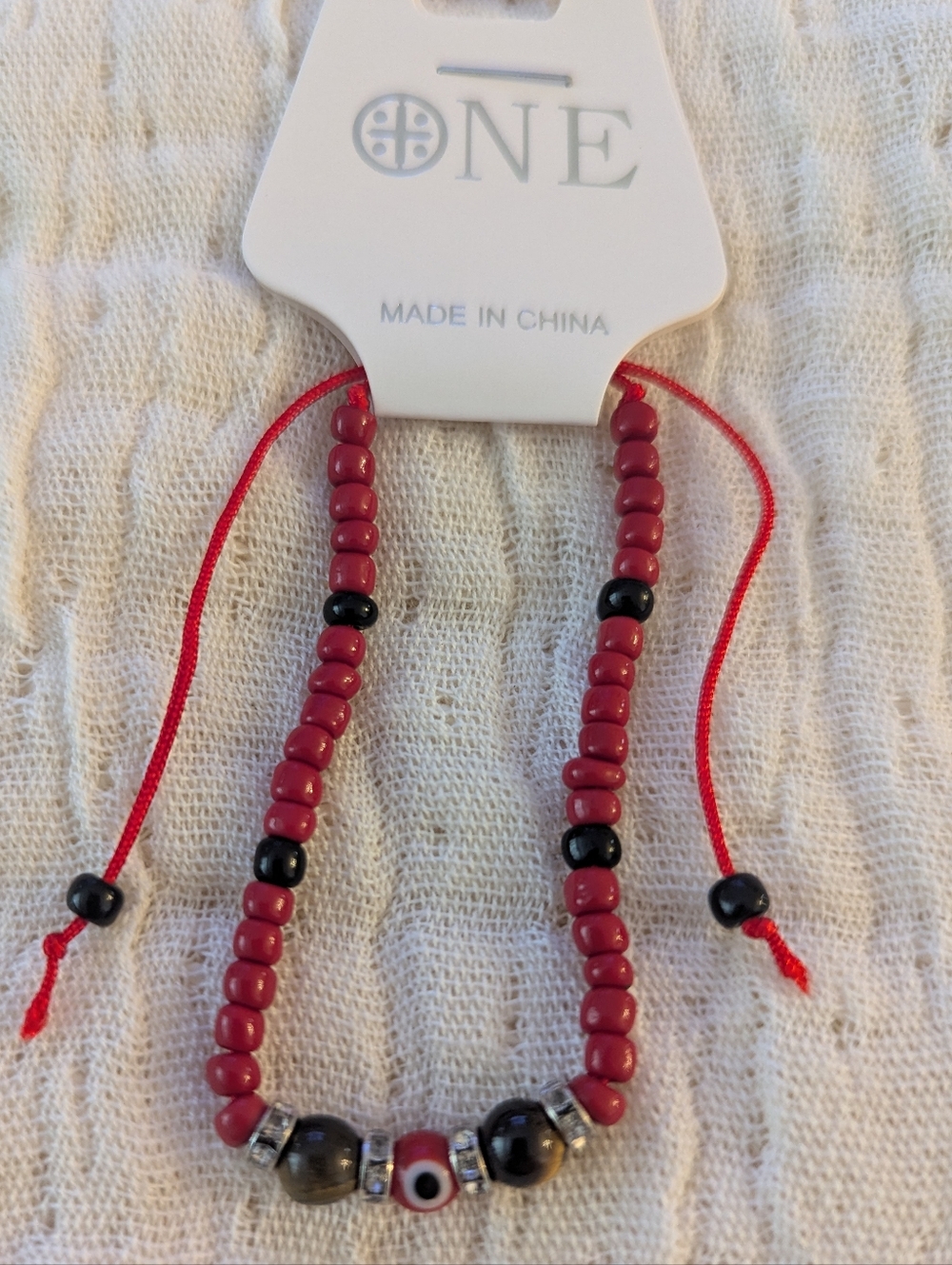 Red and Black Beaded Bracelet with Evil Eye Charm